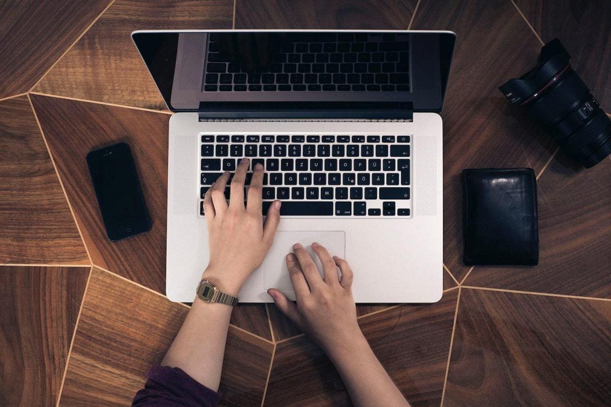 researching on a laptop