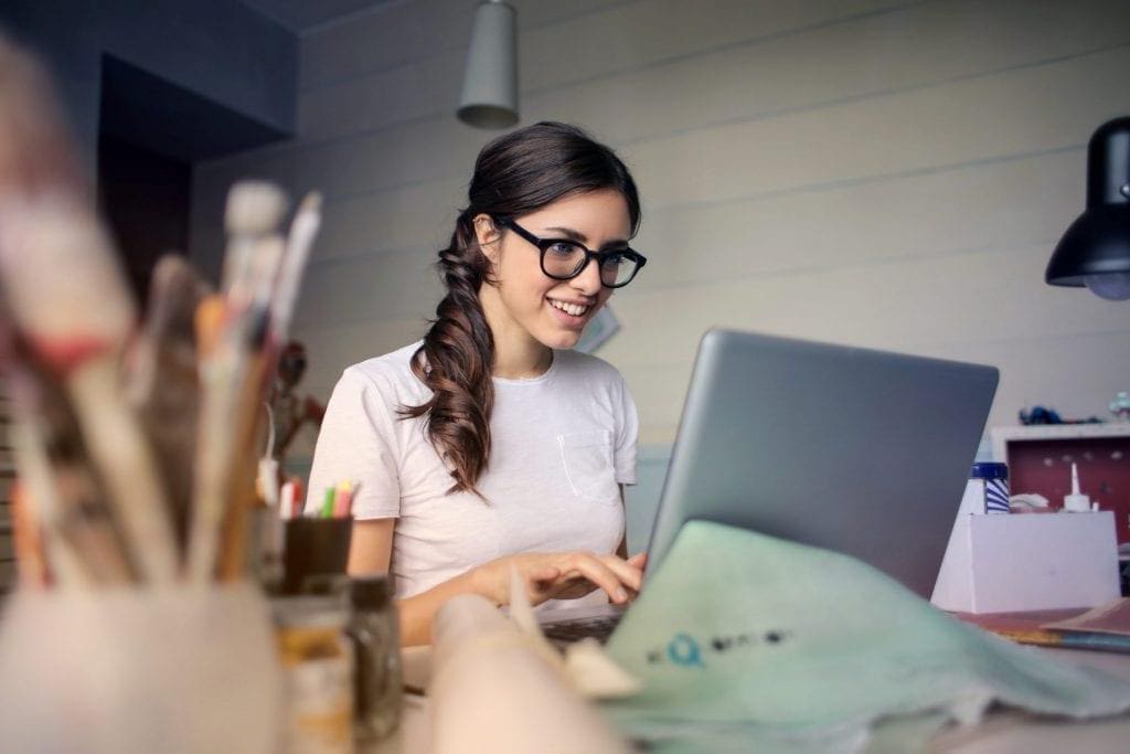 woman researching used cars online