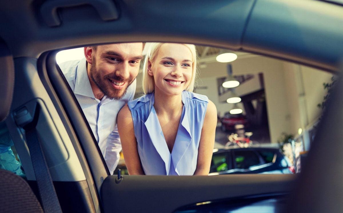 couple shopping for a used car