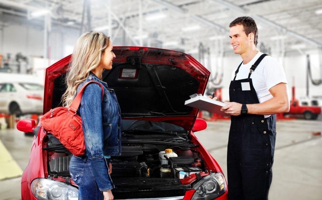 car mechanic with customer