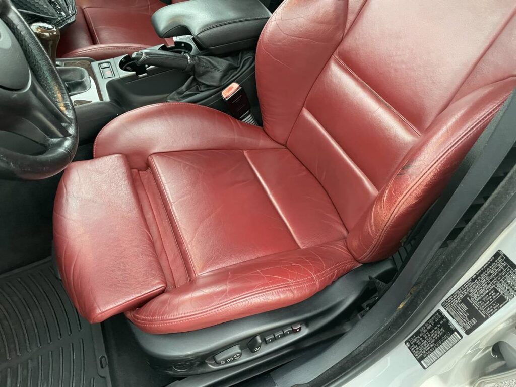 2001 BMW 325i driver's seat in red
