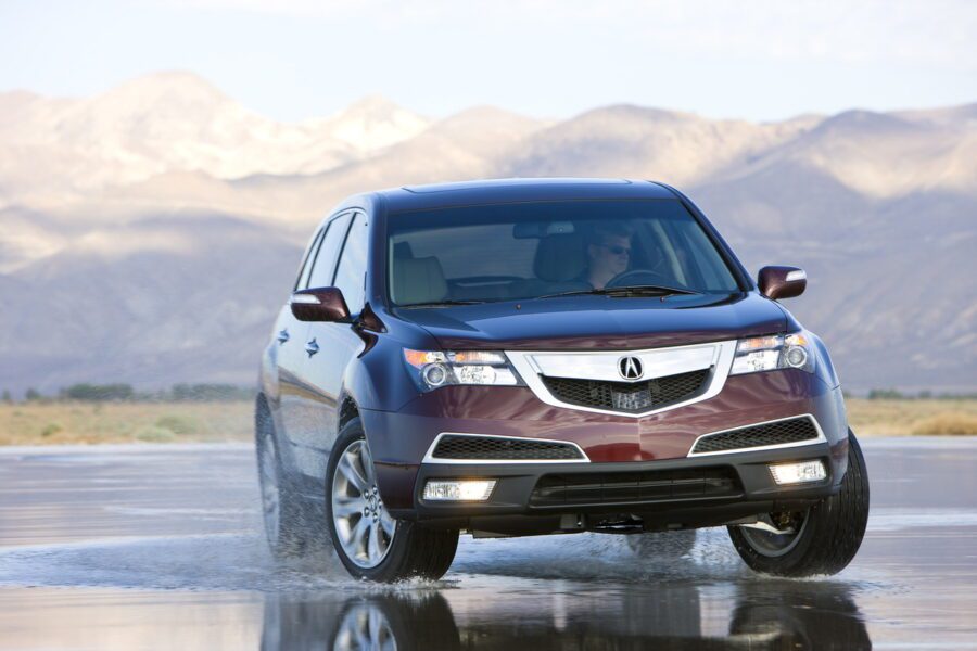 2013 Acura MDX driving on wet road
