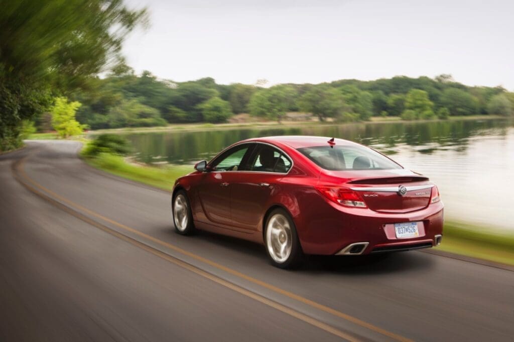 2013 Buick Regal GS driving on a winding road