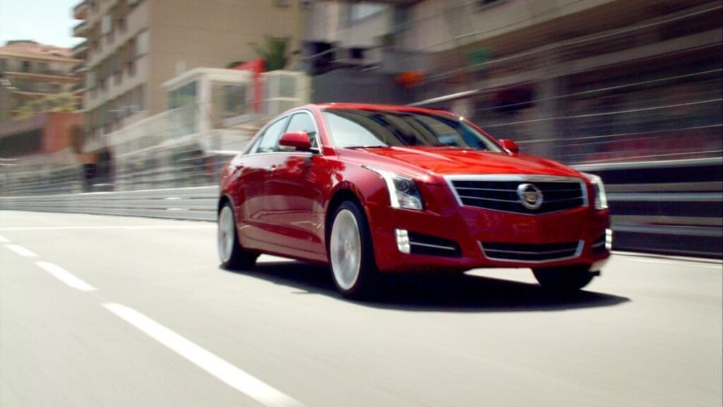 2013 Cadillac ATS driving through town