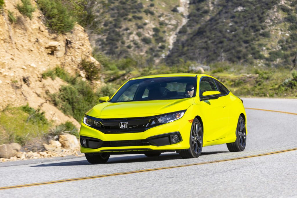 2020 Honda Civic Coupe driving on a backroad