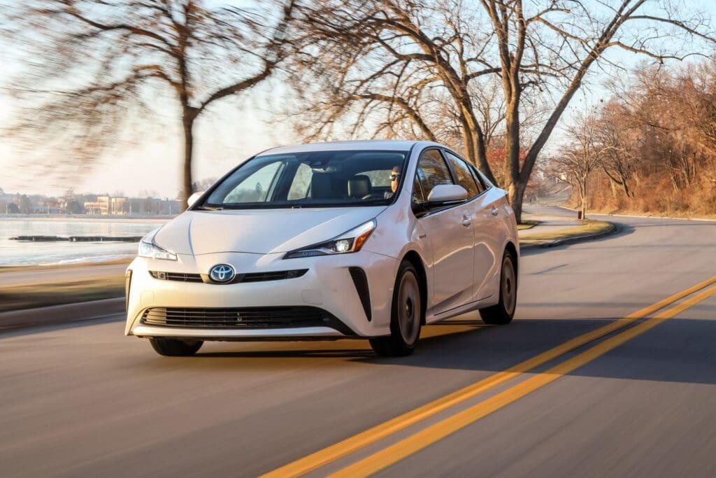 2019 Toyota Prius driving by the lakeshore