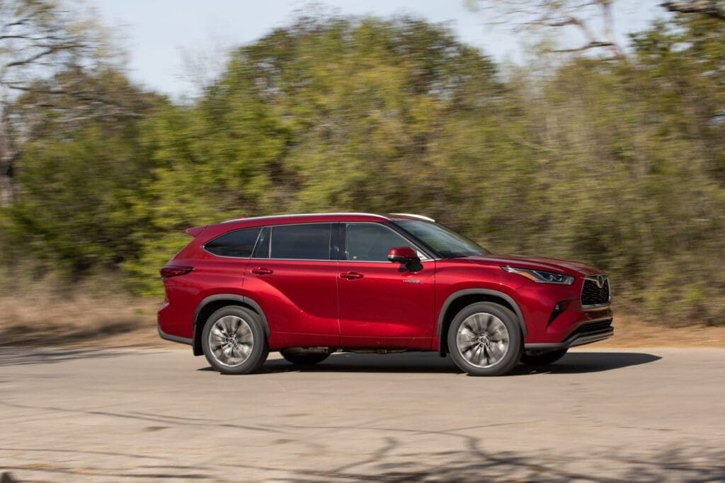 2020 Toyota Highlander Hybrid driving on a back road