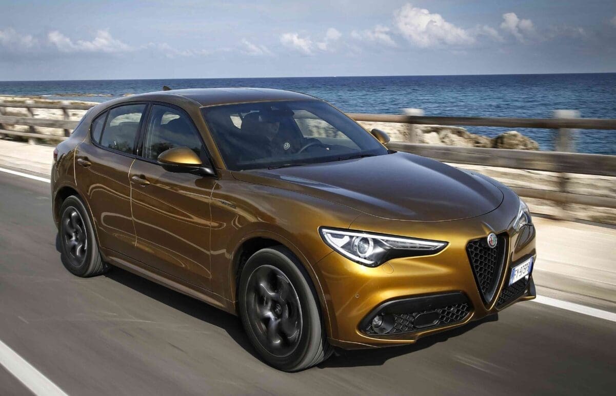 2021 Alfa Romeo Stelvio driving beside the ocean