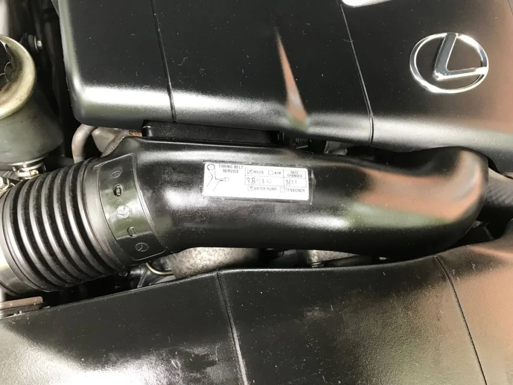 1999 Lexus LS 400 engine bay with timing belt sticker