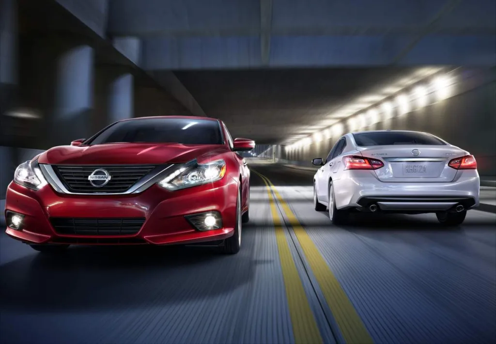 Two 2016 Nissan Altimas driving past each other